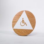Slack modern wood and white restroom door sign