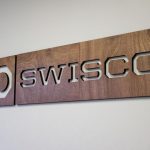 Swisco dark wood signage