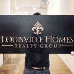 Laser etched black wood sign for louisville homes