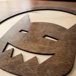 Round wood sign for Tiny Little Monster