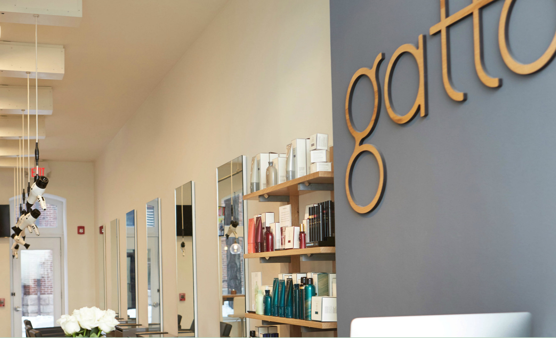 light wood sign at salon gatto light wood sign at salon gatto