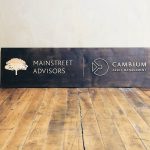 Mainstreet Advisors Torched Wood Sign