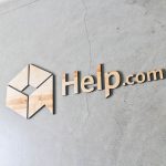 Help.com floating wood lobby sign