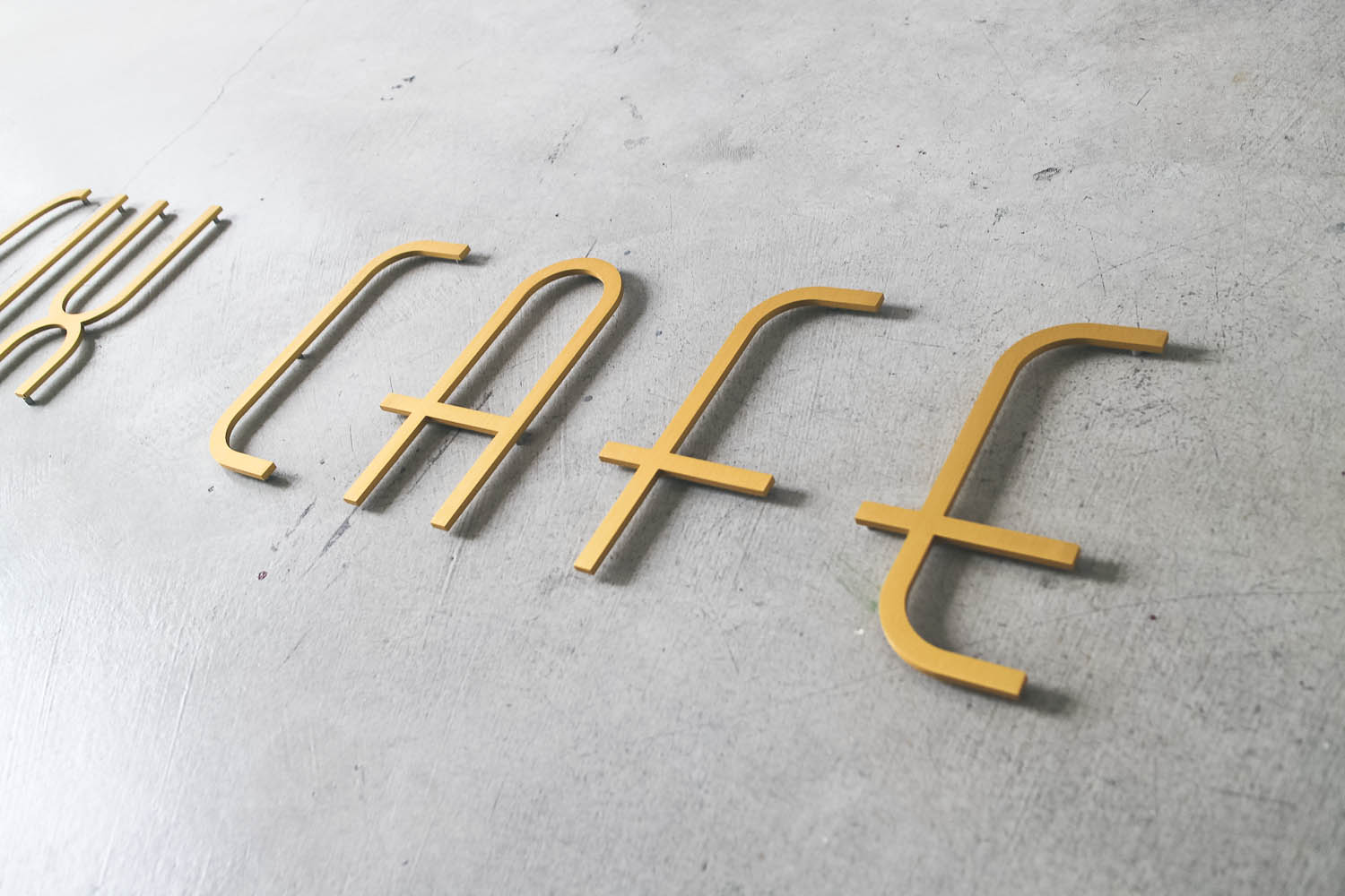 25 Cafe Gold Metal Sign
