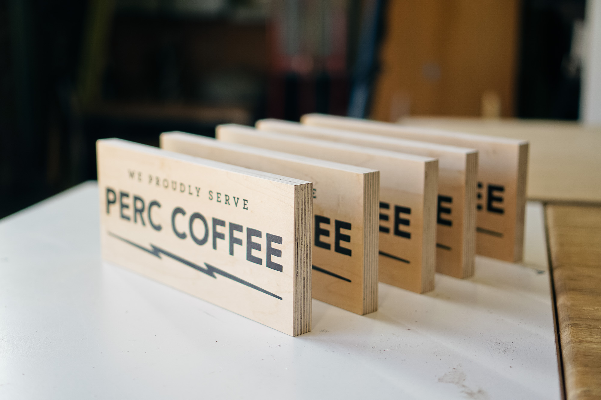 Wood tabletop retail signs for Perc Coffee, a premium coffee roaster in the heart of beautiful Savannah, GA Wood tabletop retail signs for Perc Coffee, a premium coffee roaster in the heart of beautiful Savannah, GA