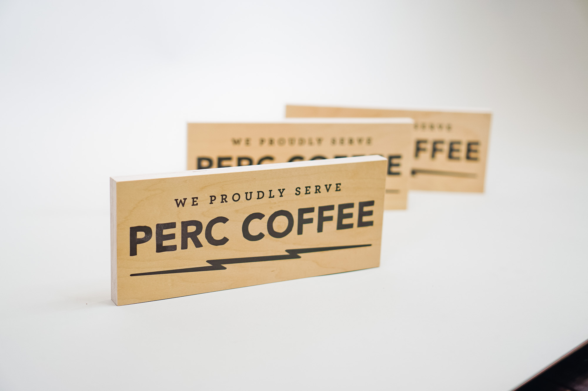 Wood tabletop retail signs for Perc Coffee, a premium coffee roaster in the heart of beautiful Savannah, GA Wood tabletop retail signs for Perc Coffee, a premium coffee roaster in the heart of beautiful Savannah, GA