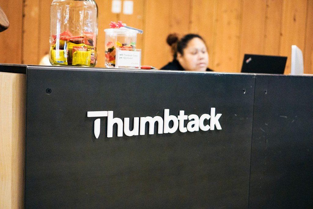 Thumbtack front desk sign