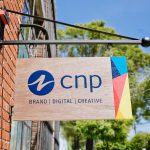 CNP wood and color hanging blade sign