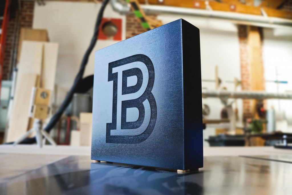 b black tabletop sign