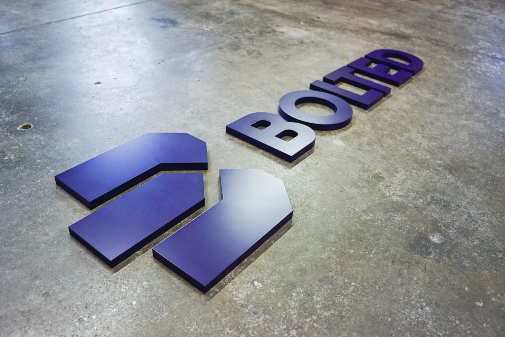 Bolted purple wall sign