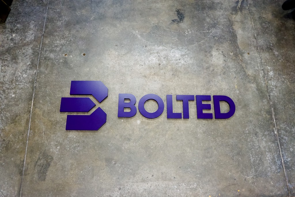 Bolted purple wall sign