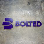Bolted purple wall sign