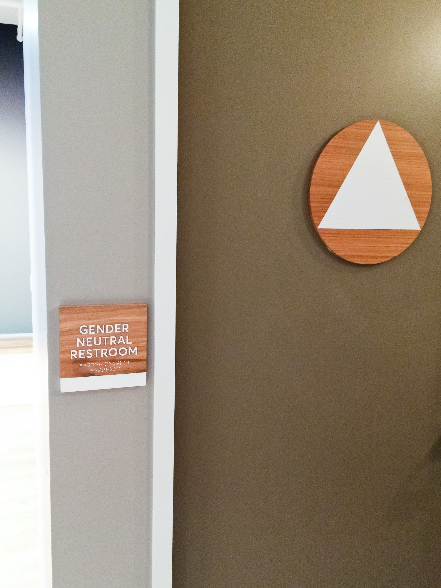 White-painted wood, California ADA signs for the office of Slack, a cloud-based set of proprietary team collaboration tools and services.