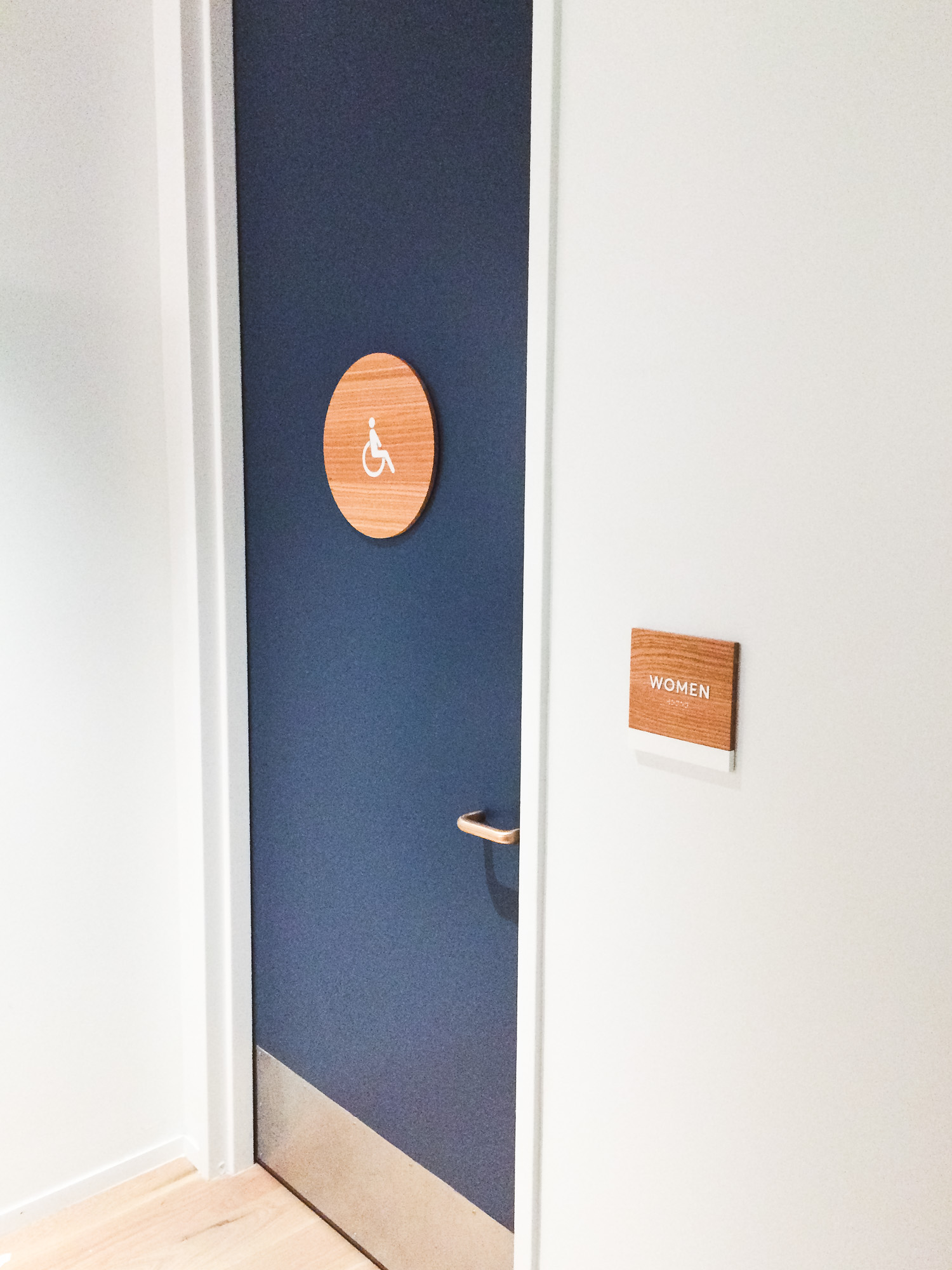 White-painted wood, California ADA signs for the office of Slack, a cloud-based set of proprietary team collaboration tools and services. White-painted wood, California ADA signs for the office of Slack, a cloud-based set of proprietary team collaboration tools and services.