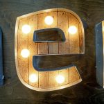 vintage / retro illuminated marquee sign with reclaimed wood and bulbs for tech / startup office, Heroku