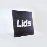 Lids torched wood and silver flat graphics retail sign