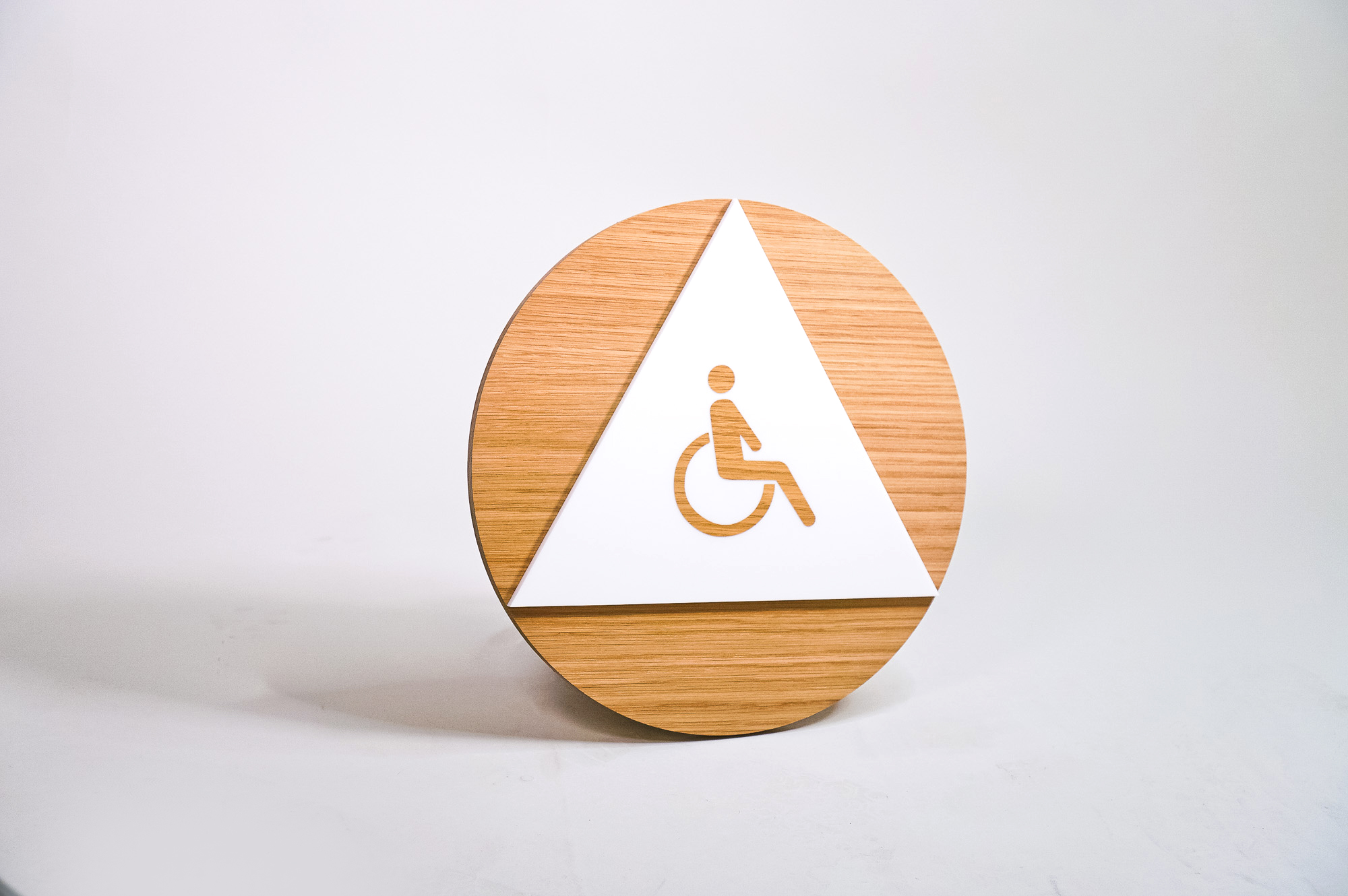 Modern light wood and white handicap ADA restroom signs for Slack, a cloud-based set of proprietary team collaboration tools and services. Modern light wood and white handicap ADA restroom signs for Slack, a cloud-based set of proprietary team collaboration tools and services.