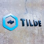 tilde black and teal tech startup modern lobby wall sign