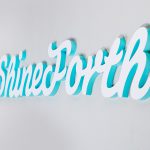 shineforth tech office sign, white with colored edges