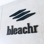 Black painted wood logo for Bleachr, who creates a mobile platform built for athletic teams.