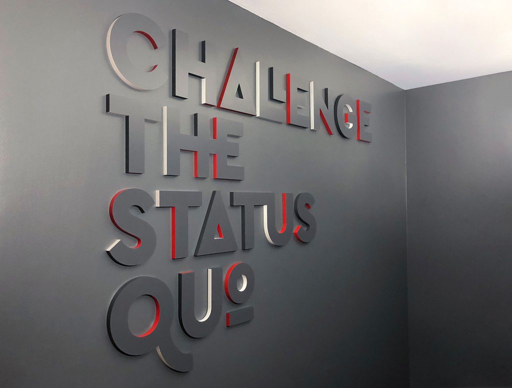 Challenge The Status Quo Lobby Sign at Envoy