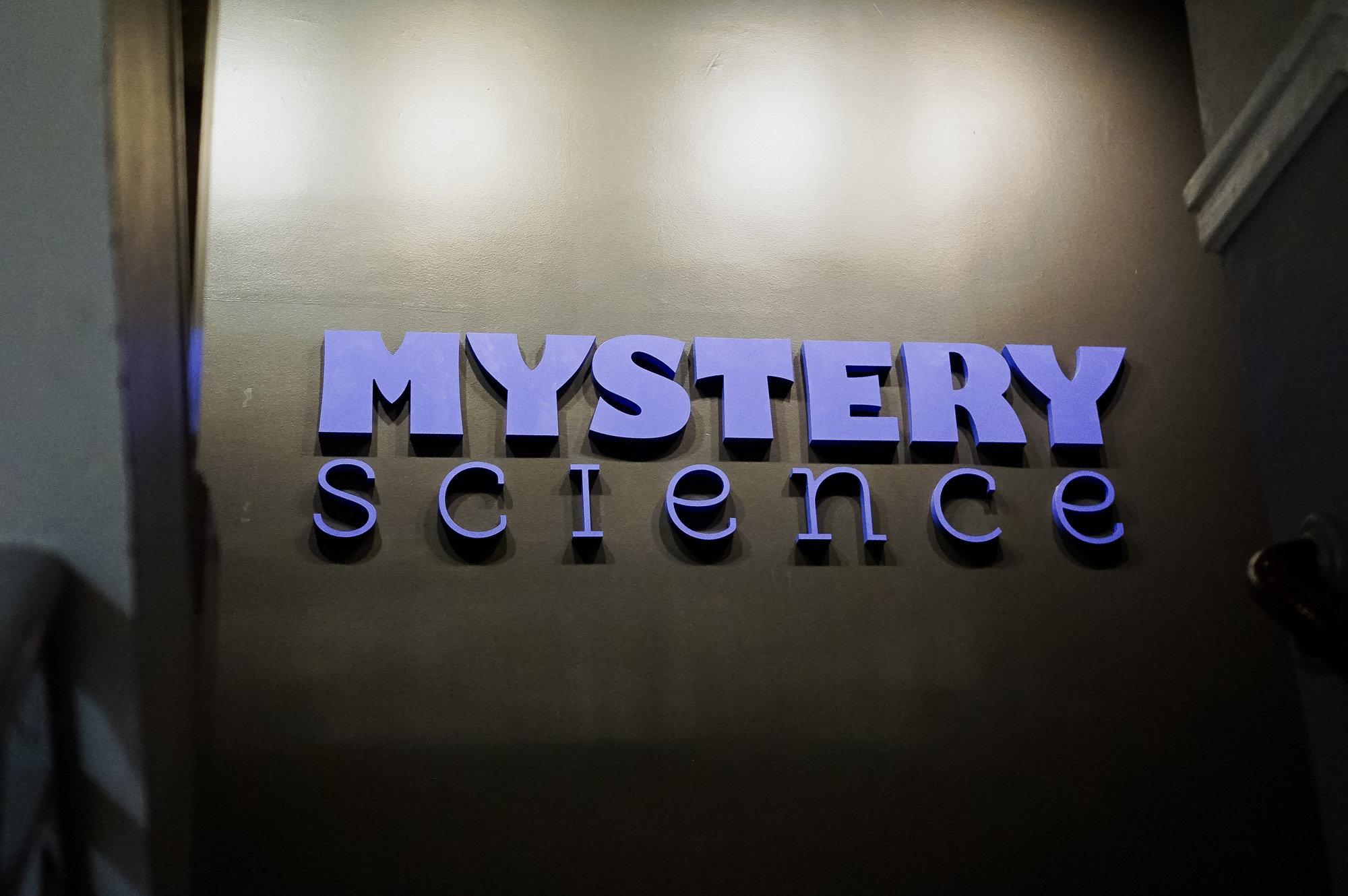 Purple letters on dark grey wall for the Knotel designed Mystery Science lobby, a company that provides open-and-go lessons that inspire kids to love science. Purple letters on dark grey wall for the Knotel designed Mystery Science lobby, a company that provides open-and-go lessons that inspire kids to love science.