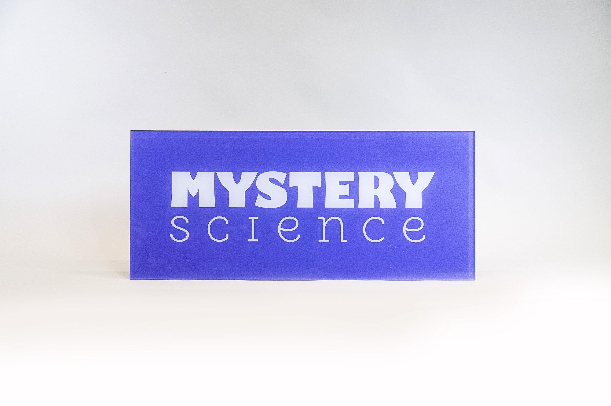 Glass-like colored panel sign for the Knotel designed Mystery Science lobby, a company that provides open-and-go lessons that inspire kids to love science. Glass-like colored panel sign for the Knotel designed Mystery Science lobby, a company that provides open-and-go lessons that inspire kids to love science.