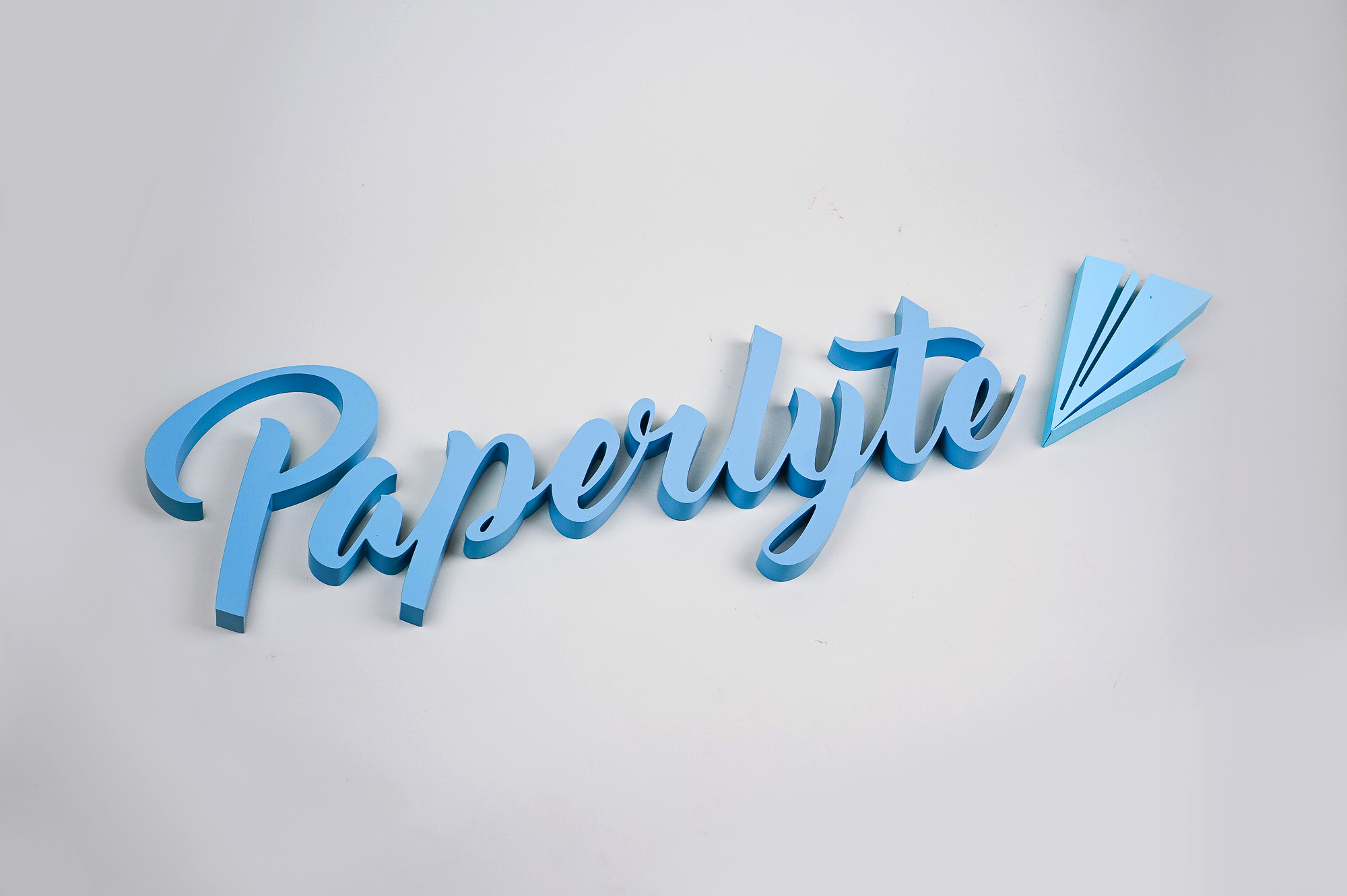 Blue dimensional script sign for Paperlyte, a media production company specializing in live streaming, video, documentary, and commercial content. Blue dimensional script sign for Paperlyte, a media production company specializing in live streaming, video, documentary, and commercial content.