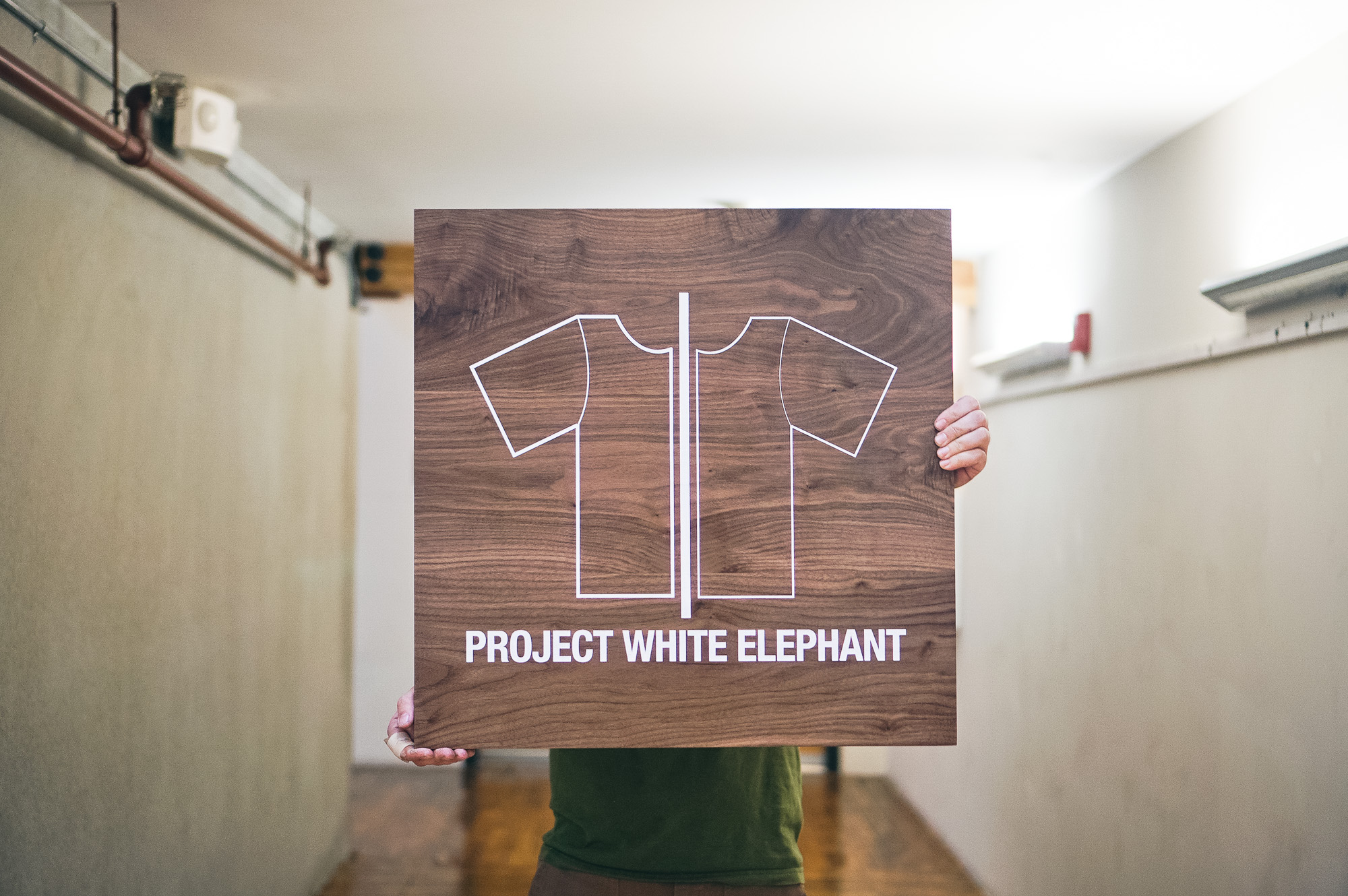 Solid walnut sign with white artwork for Project White Elephant, a womenswear brand based in San Francisco, California. Solid walnut sign with white artwork for Project White Elephant, a womenswear brand based in San Francisco, California.
