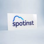 Glossy, glass-like back printed panel sign for the office of Spotinst, a San Francisco company that creates workload software.