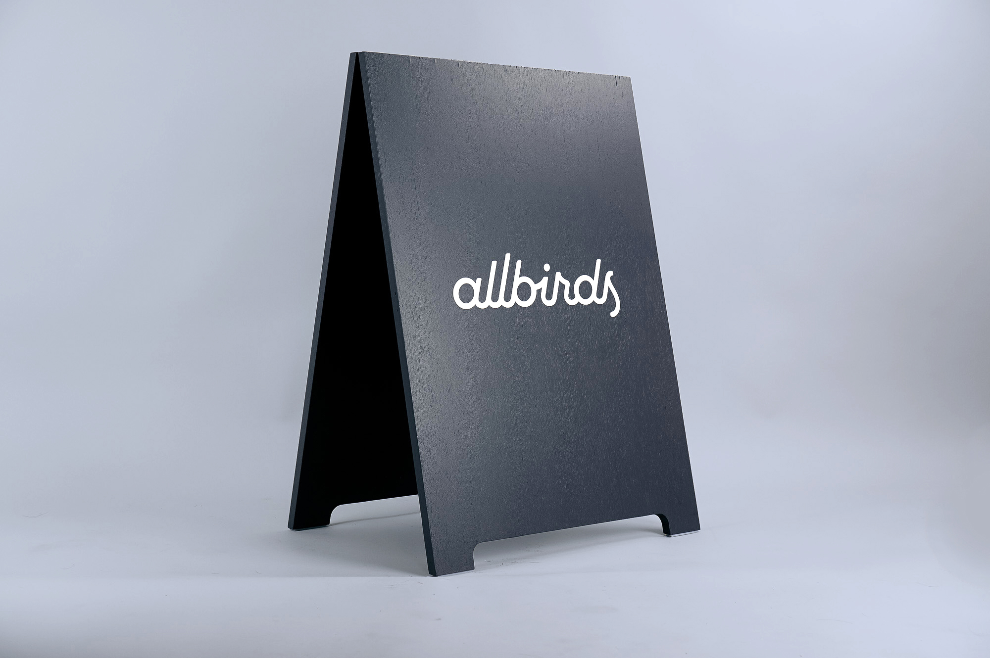 Minimalist black and white A-frame for Allbirds, a San Francisco-based direct-to-consumer startup aimed at designing environmentally friendly footwear.
