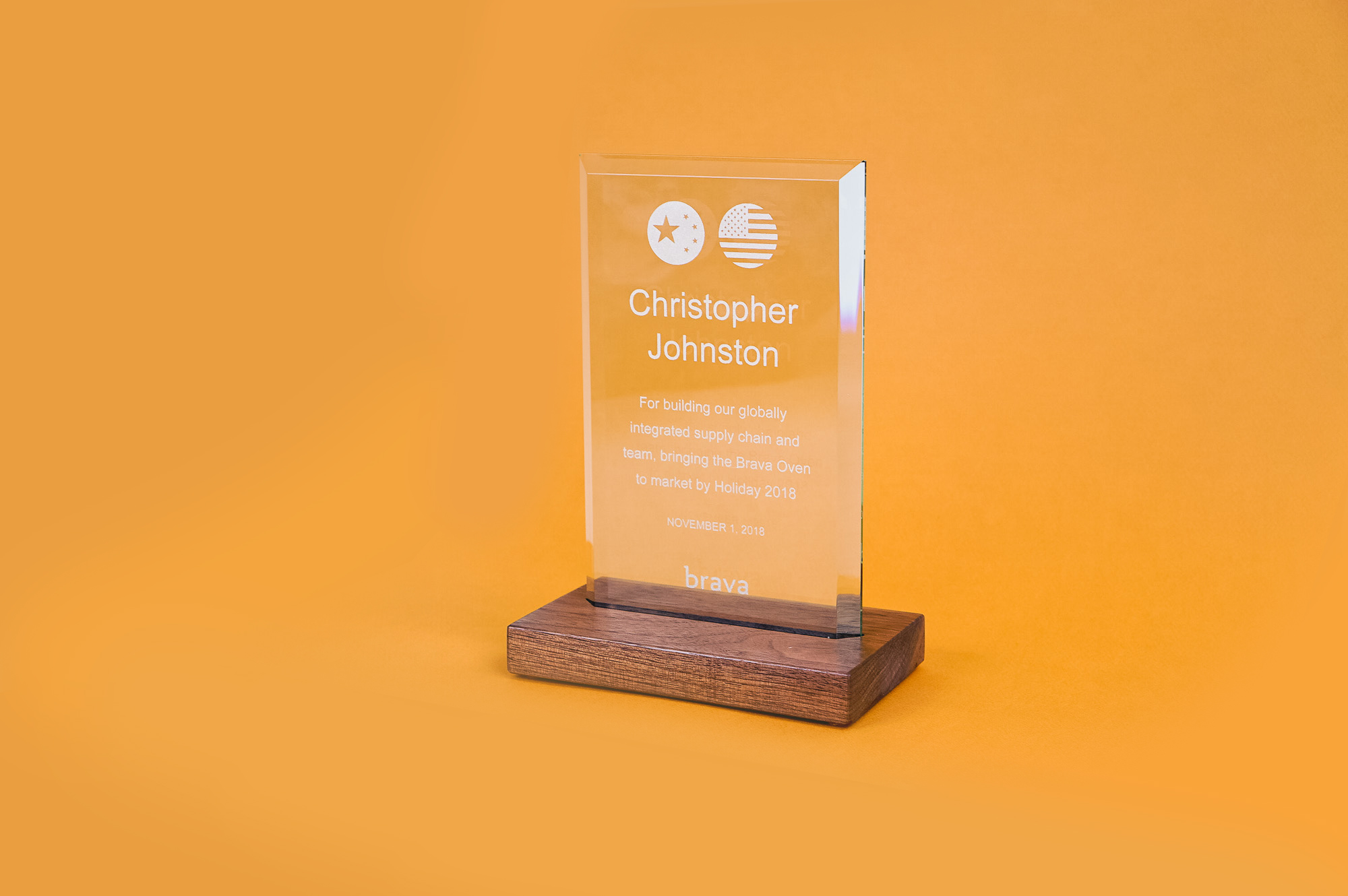 Simple walnut and engraved glass award for Brava, a company that creates a smart countertop oven.