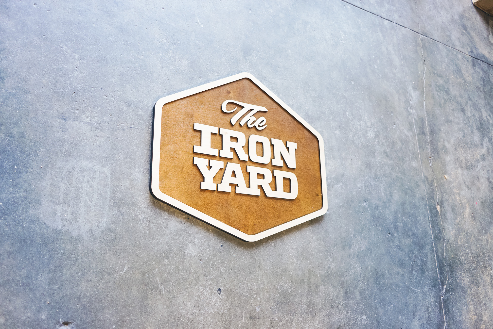 Raised two-toned wood sign for The Iron Yard, a 12-week coding school offered in multiple cities across the US and in London. Raised two-toned wood sign for The Iron Yard, a 12-week coding school offered in multiple cities across the US and in London.