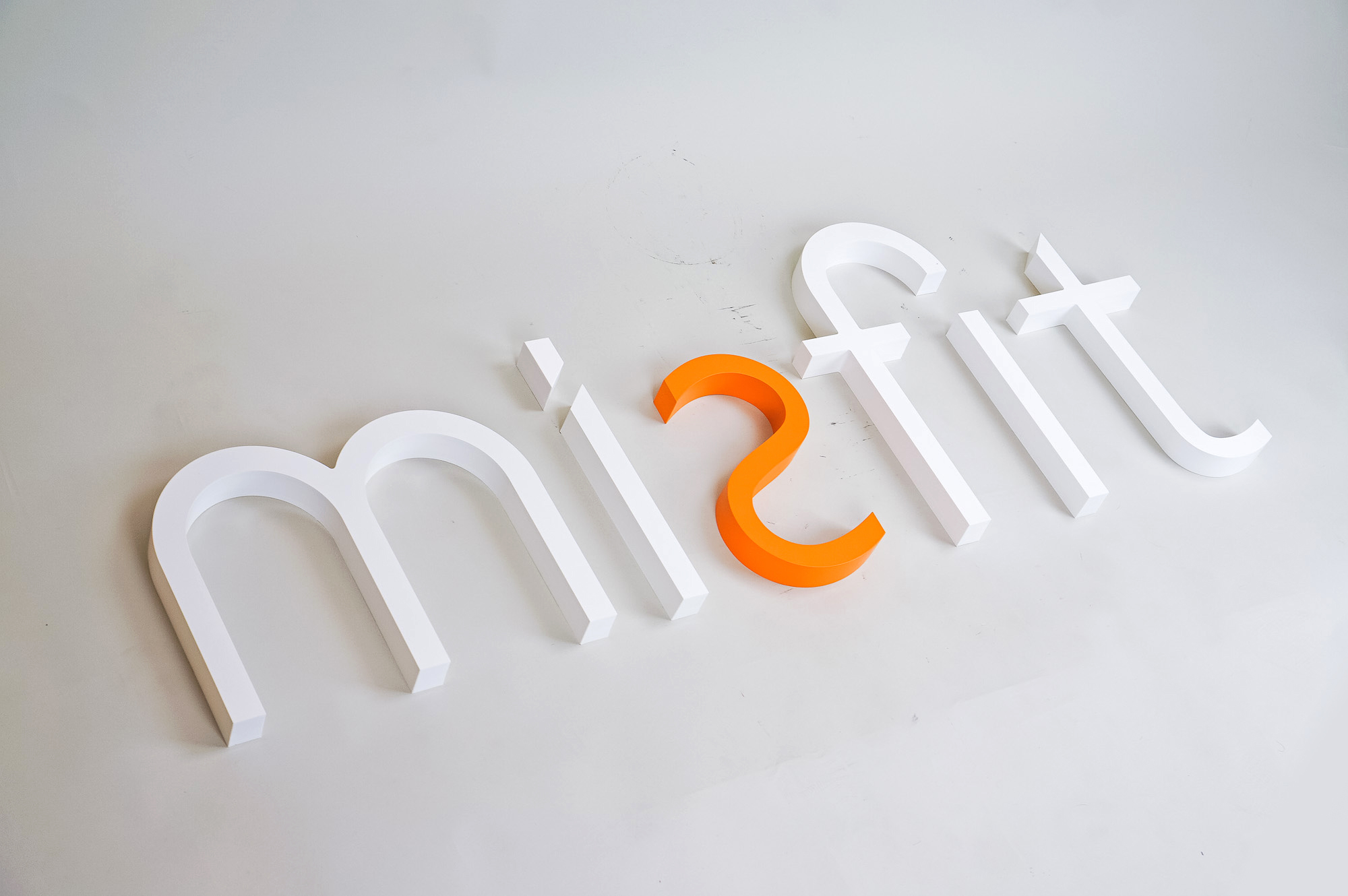 White and orange letter sign for Misfit, a strategic marketing agency. White and orange letter sign for Misfit, a strategic marketing agency.