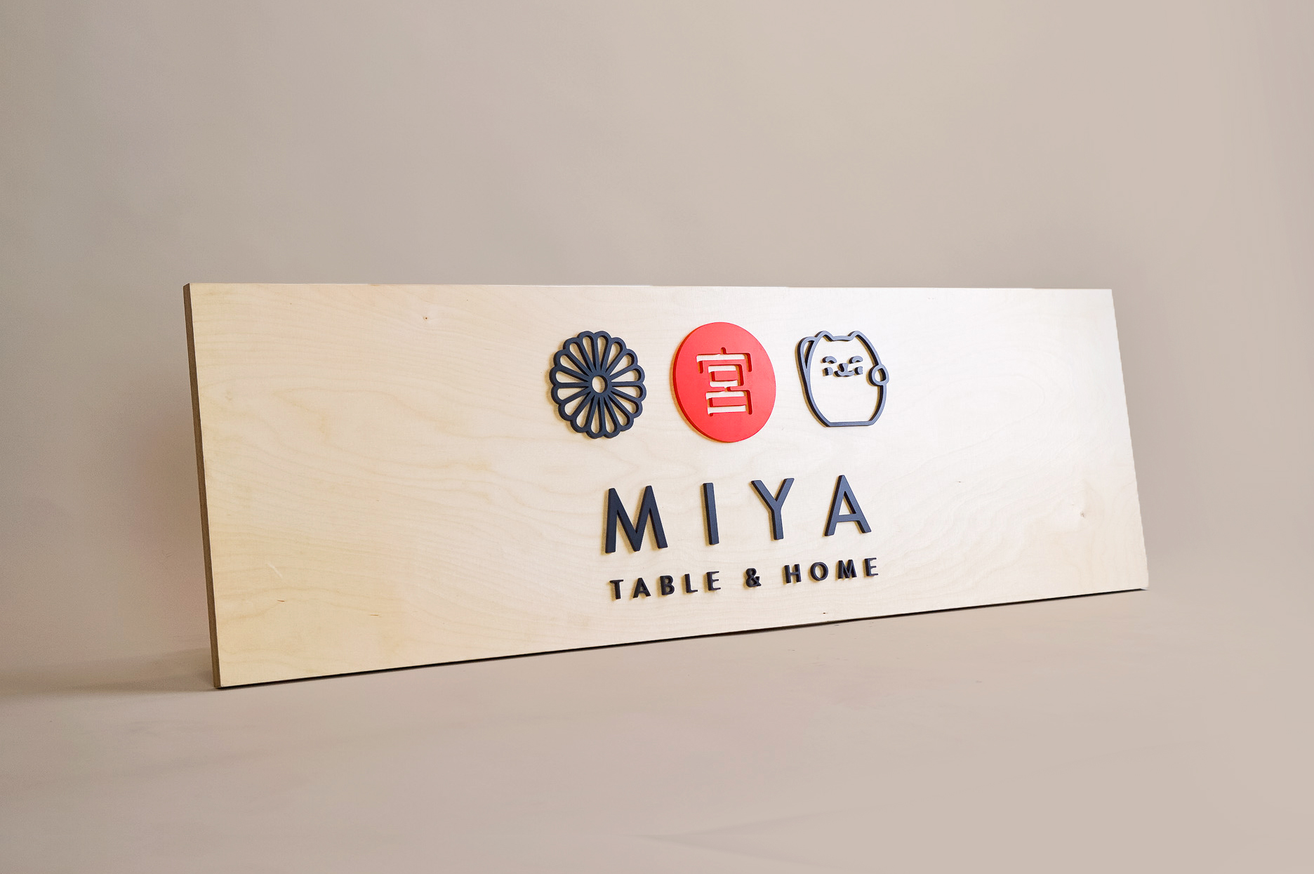 Raised black, red, and light wood sign with icons for Miya Table & Home, a third-generation family owned business, importing Japanese tableware and gifts since 1947. Raised black, red, and light wood sign with icons for Miya Table & Home, a third-generation family owned business, importing Japanese tableware and gifts since 1947.