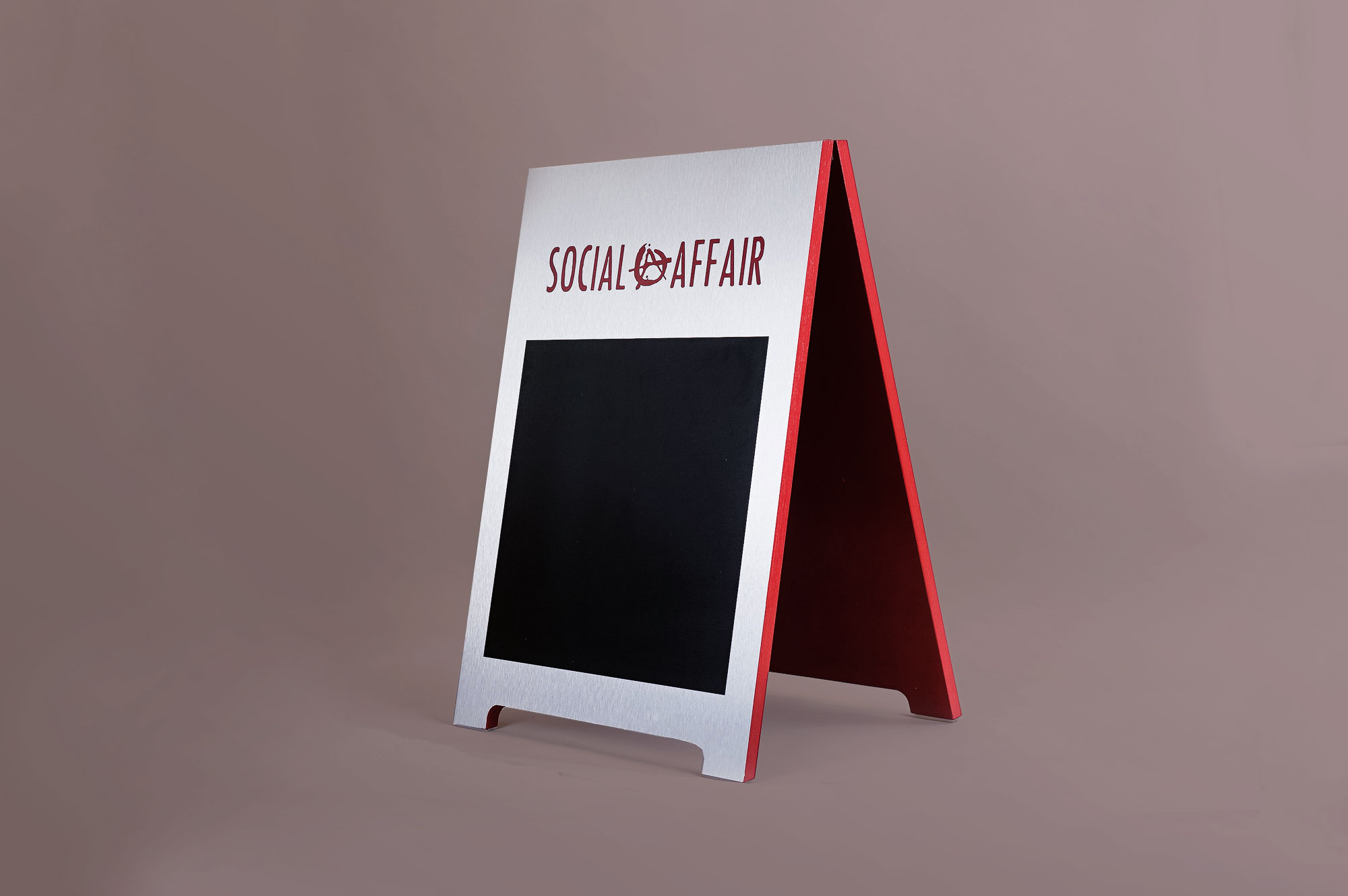 Metal and red A-frame sign for Social Affair, a restaurant serving artisanal food, wine and chai in a casual and modern lounge Metal and red A-frame sign for Social Affair, a restaurant serving artisanal food, wine and chai in a casual and modern lounge