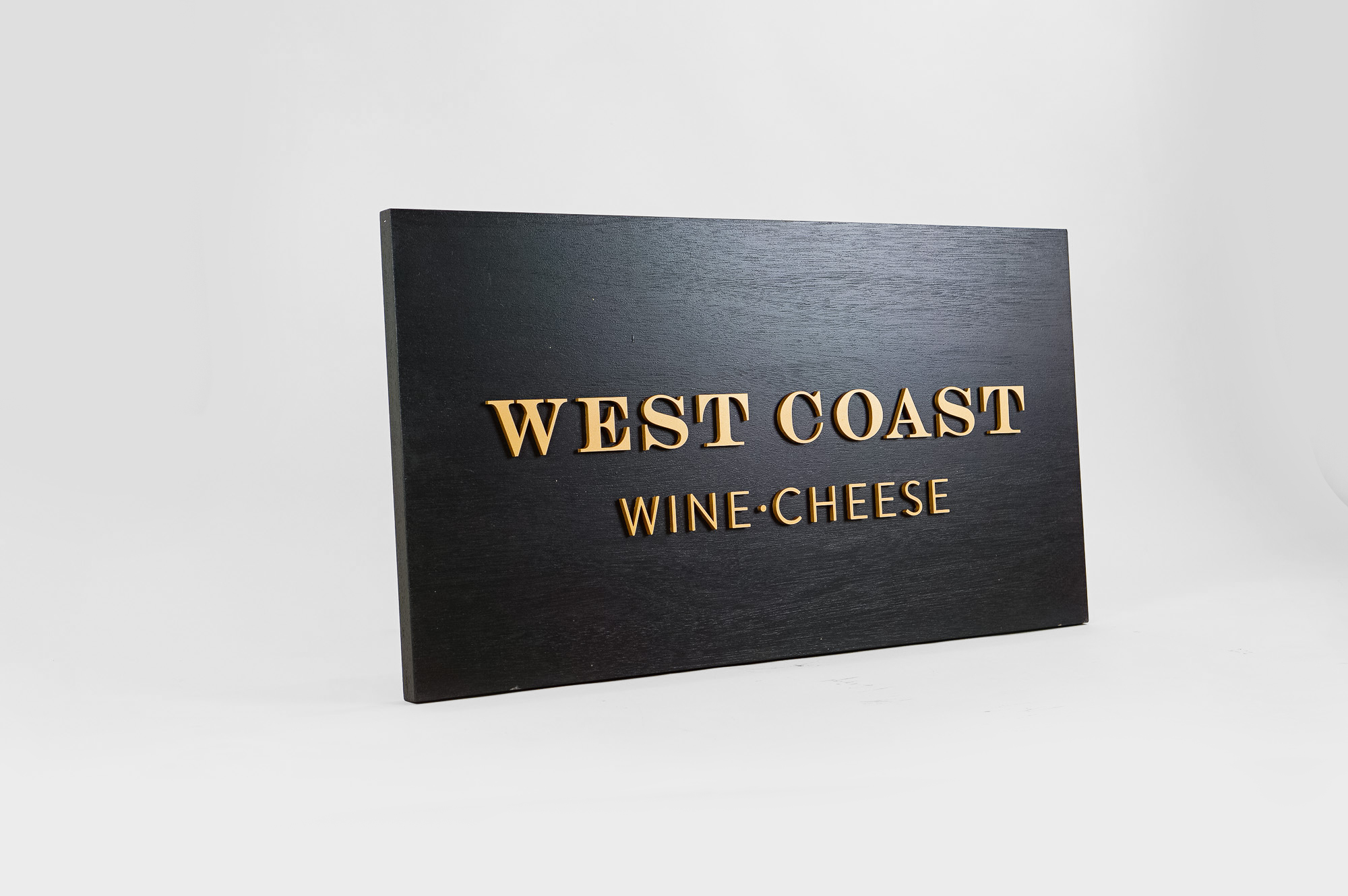 Outdoor hanging sign for West Coast Wine and Cheese, a San Francisco based bar and gastropub. Outdoor hanging sign for West Coast Wine and Cheese, a San Francisco based bar and gastropub.