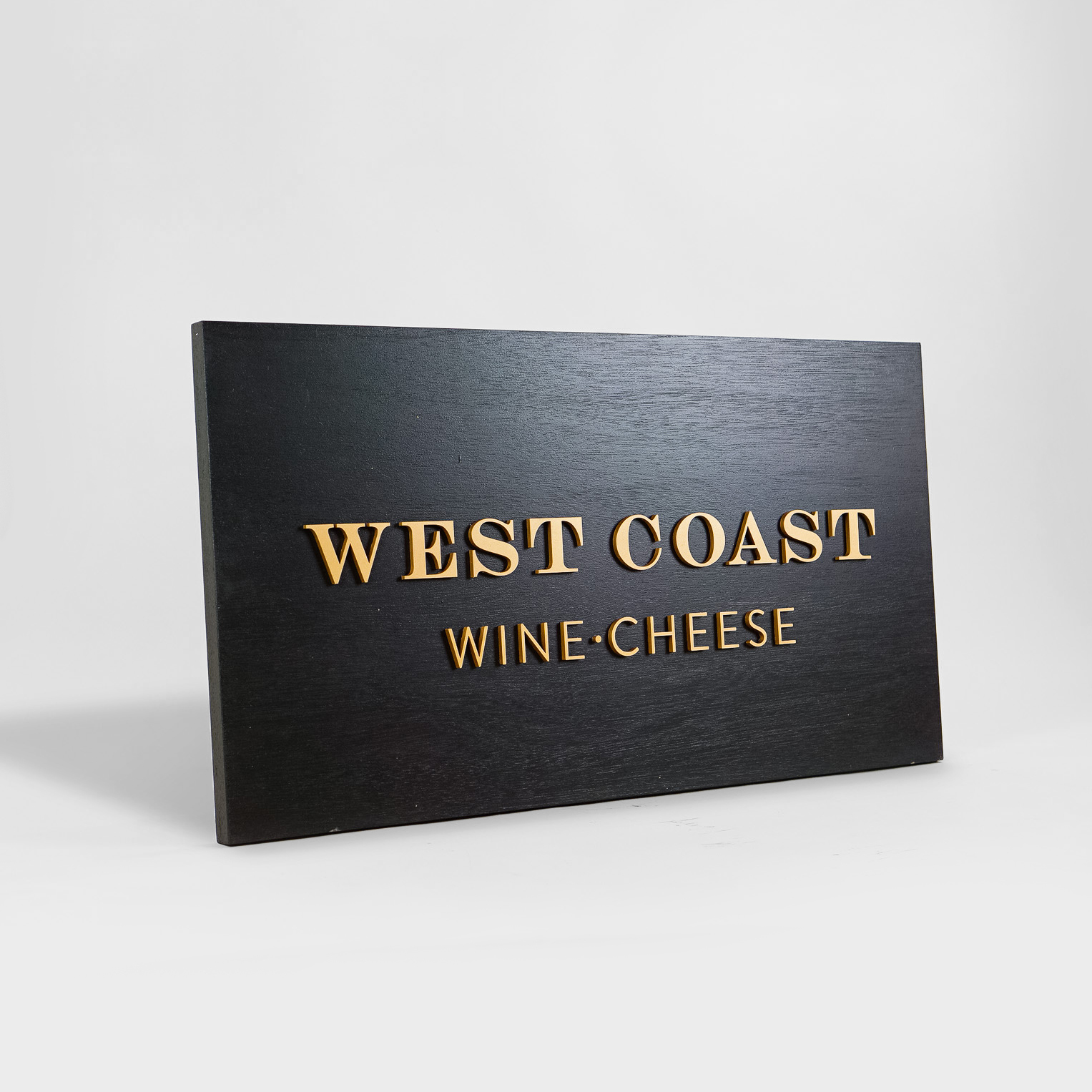 Outdoor hanging sign for West Coast Wine and Cheese, a San Francisco based bar and gastropub.