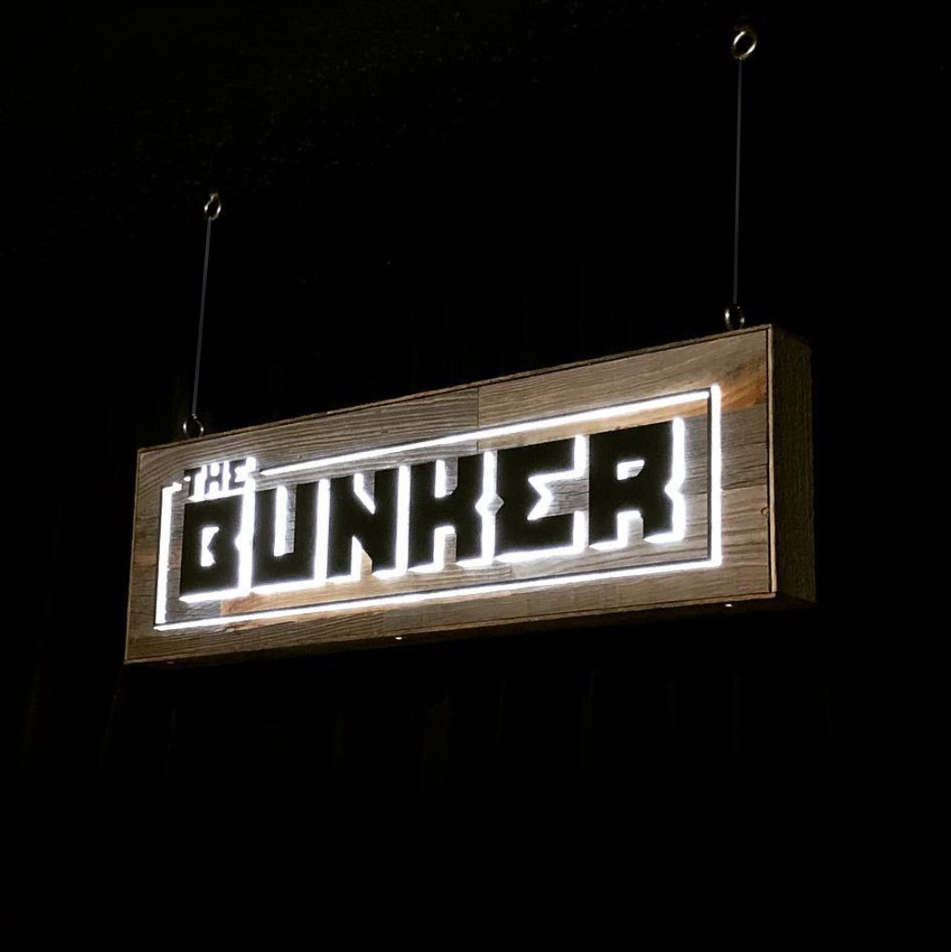 Illuminated, reclaimed wood sign for The Bunker, a comedy club in Burbank, CA. Illuminated, reclaimed wood sign for The Bunker, a comedy club in Burbank, CA.
