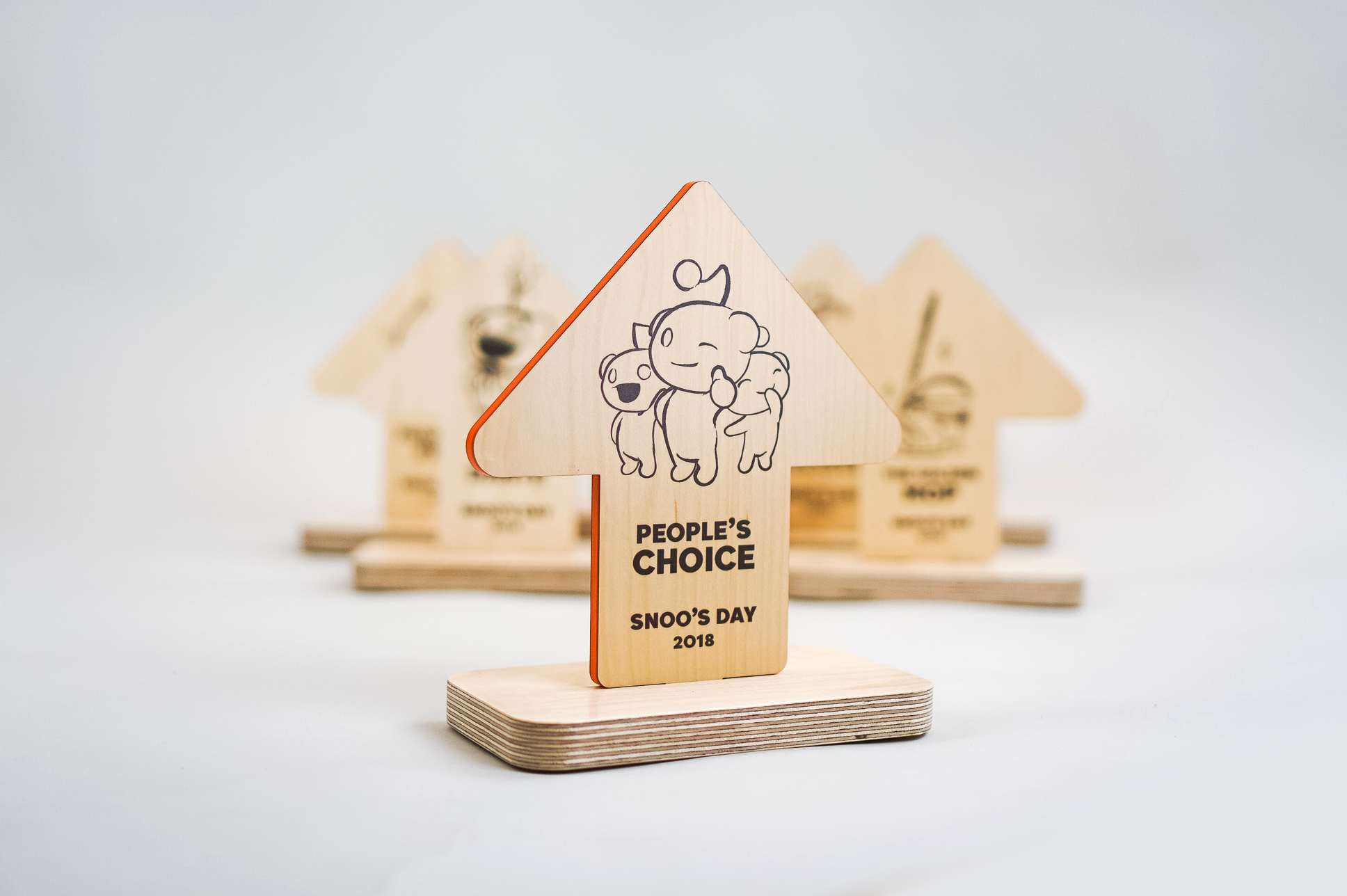 Custom wood arrow shaped 2018 team awards for Reddit, an American social news aggregation, web content rating, and discussion website.