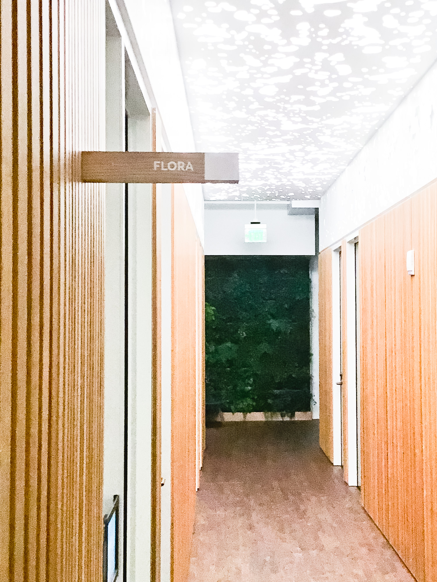 White-painted wood, national park-inspired, overhead wayfinding sign for the office of Slack, a cloud-based set of proprietary team collaboration tools and services. White-painted wood, national park-inspired, overhead wayfinding sign for the office of Slack, a cloud-based set of proprietary team collaboration tools and services.