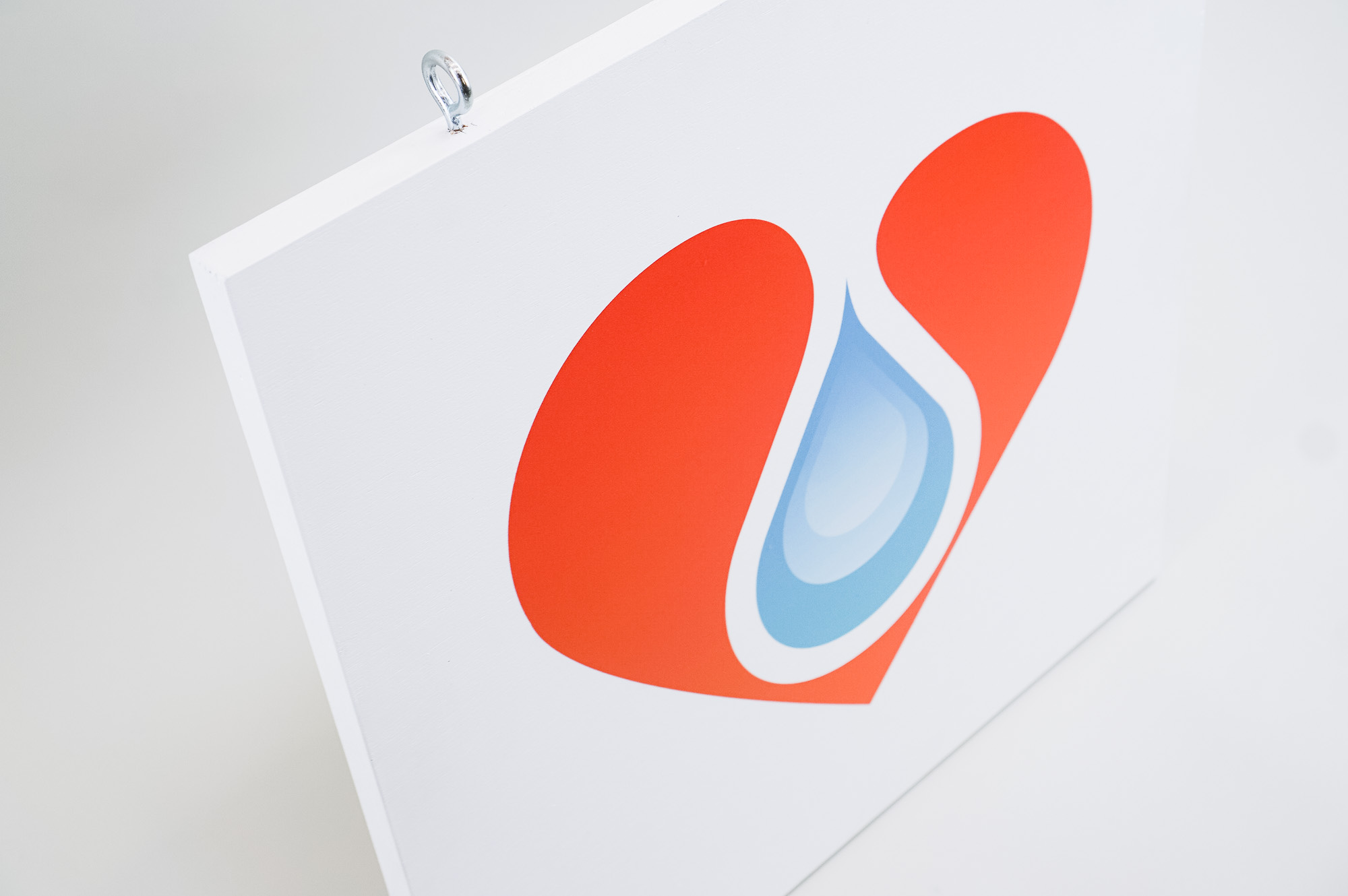 White hanging blade sign with colored logo for B12 LOVE, a San Francisco center offering nutrient therapies. White hanging blade sign with colored logo for B12 LOVE, a San Francisco center offering nutrient therapies.