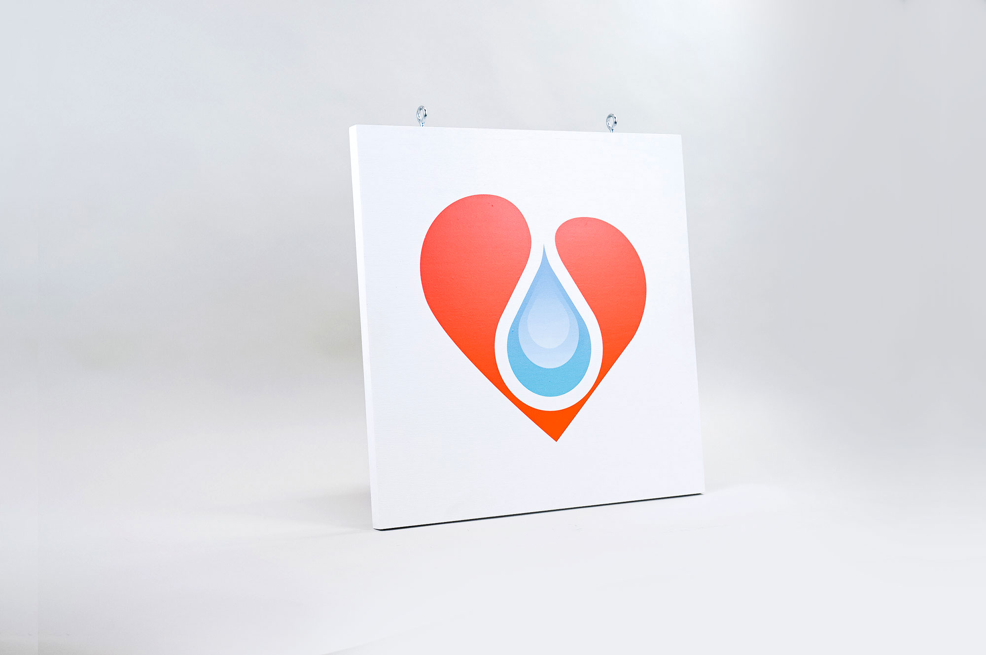 White hanging blade sign with colored logo for B12 LOVE, a San Francisco center offering nutrient therapies. White hanging blade sign with colored logo for B12 LOVE, a San Francisco center offering nutrient therapies.