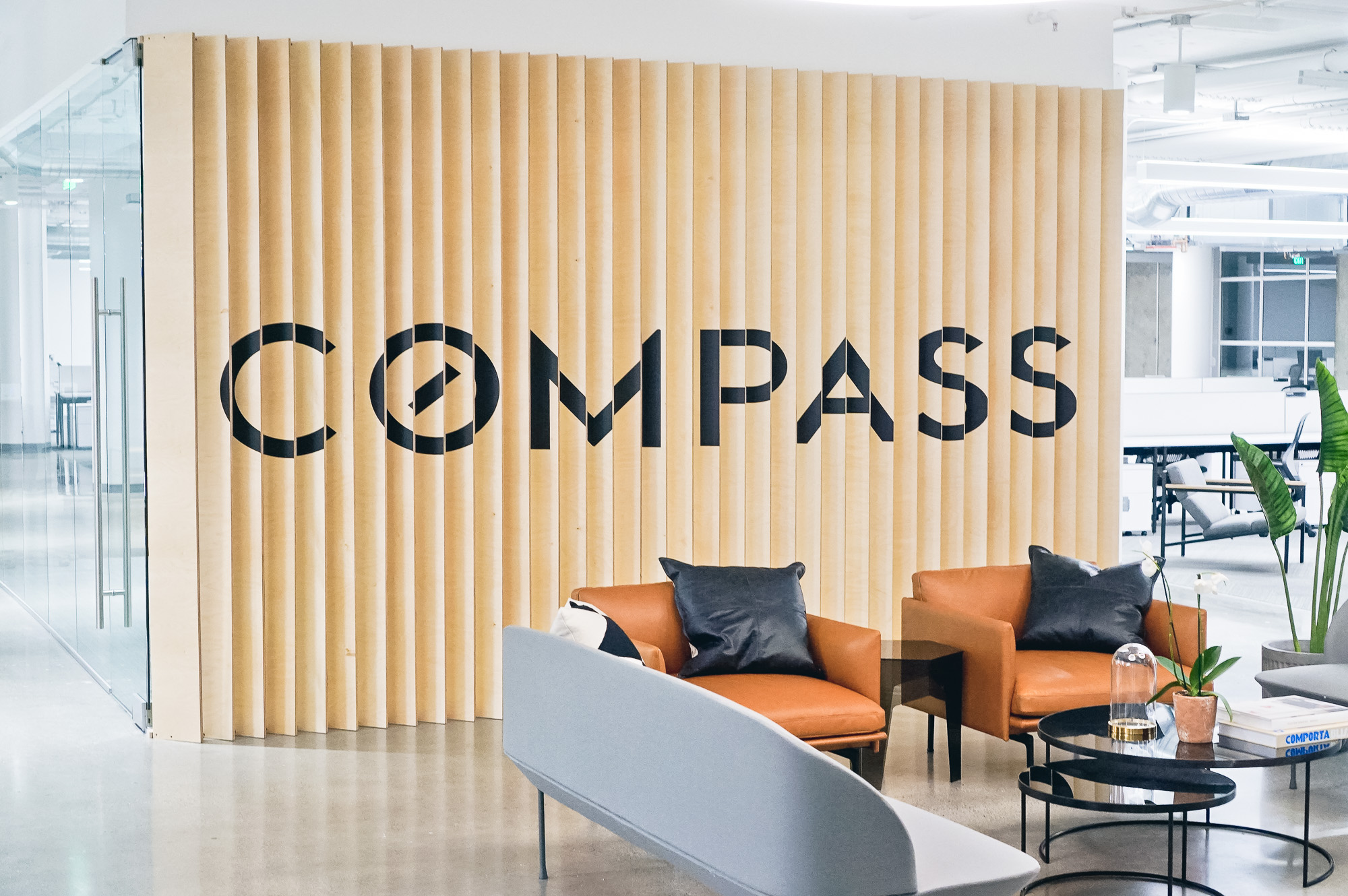 Optical-illusion, multi panel wood sign / privacy screen at the San Francisco office of Compass, a modern real estate platform. Optical-illusion, multi panel wood sign / privacy screen at the San Francisco office of Compass, a modern real estate platform.
