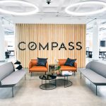 Optical-illusion, multi panel wood sign / privacy screen at the San Francisco office of Compass, a modern real estate platform.