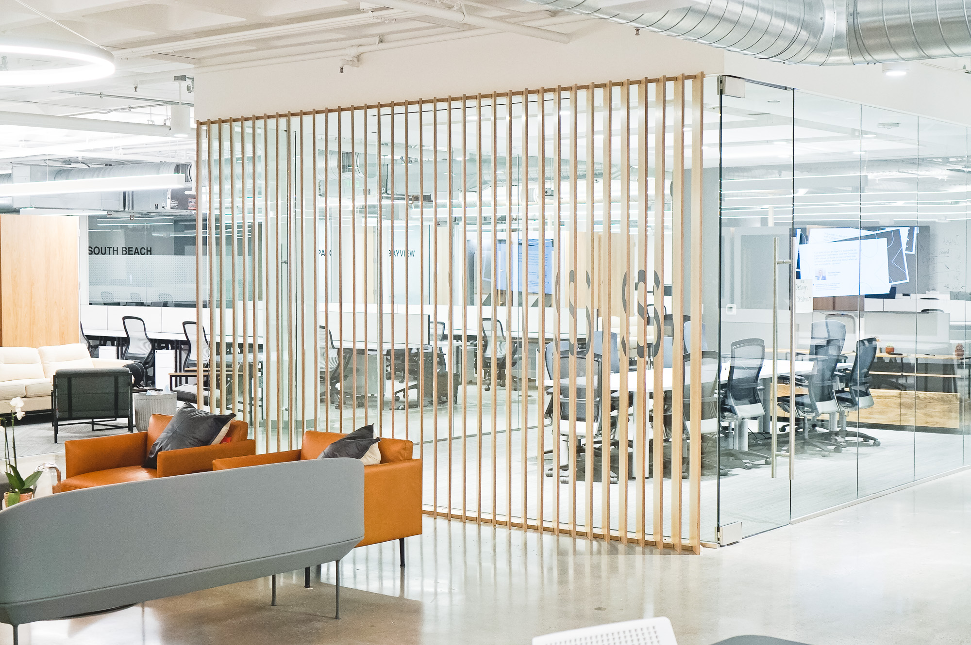 Optical-illusion, multi panel wood sign / privacy screen at the San Francisco office of Compass, a modern real estate platform. Optical-illusion, multi panel wood sign / privacy screen at the San Francisco office of Compass, a modern real estate platform.