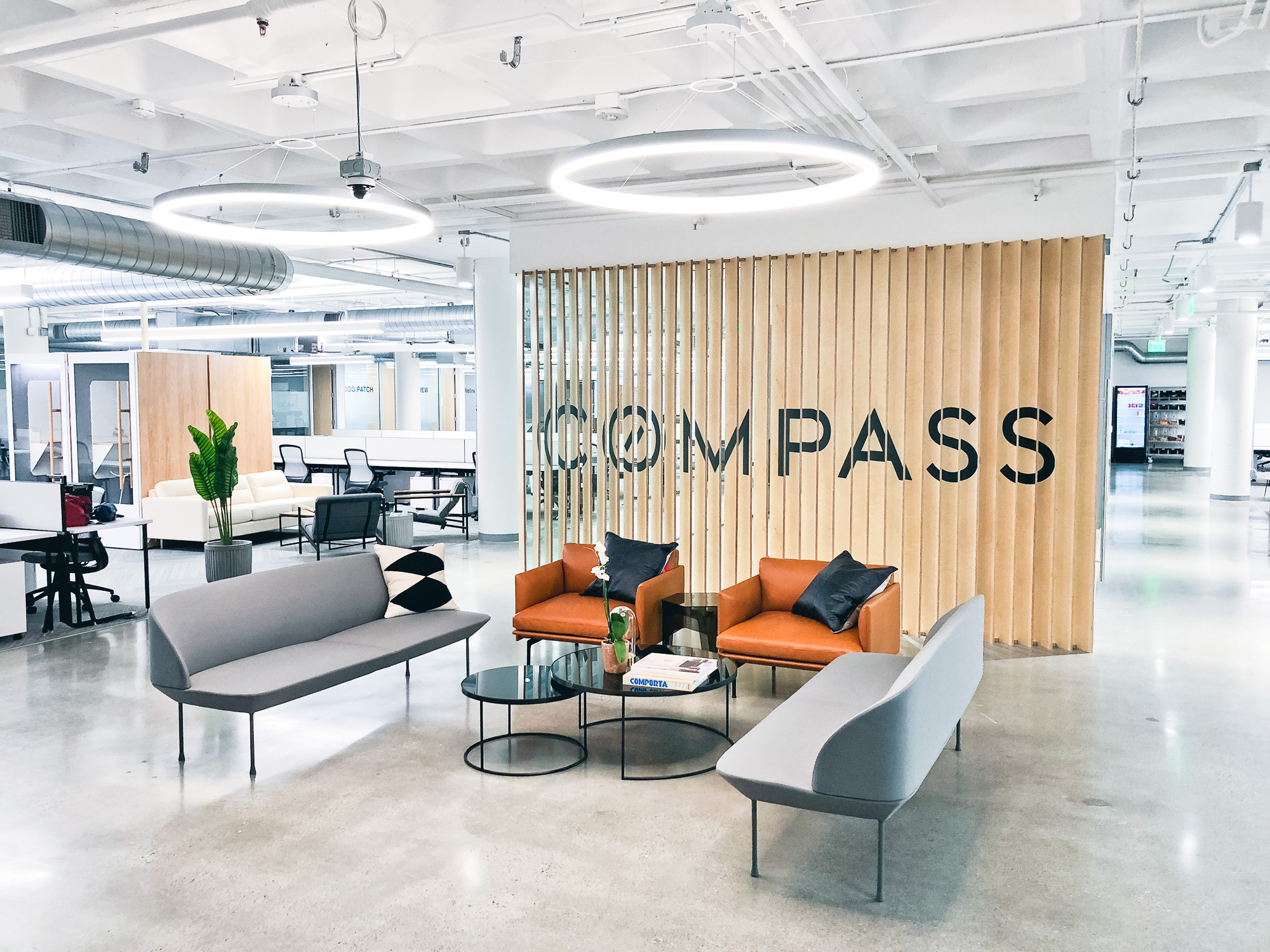 Optical-illusion, multi panel wood sign / privacy screen at the San Francisco office of Compass, a modern real estate platform. Optical-illusion, multi panel wood sign / privacy screen at the San Francisco office of Compass, a modern real estate platform.