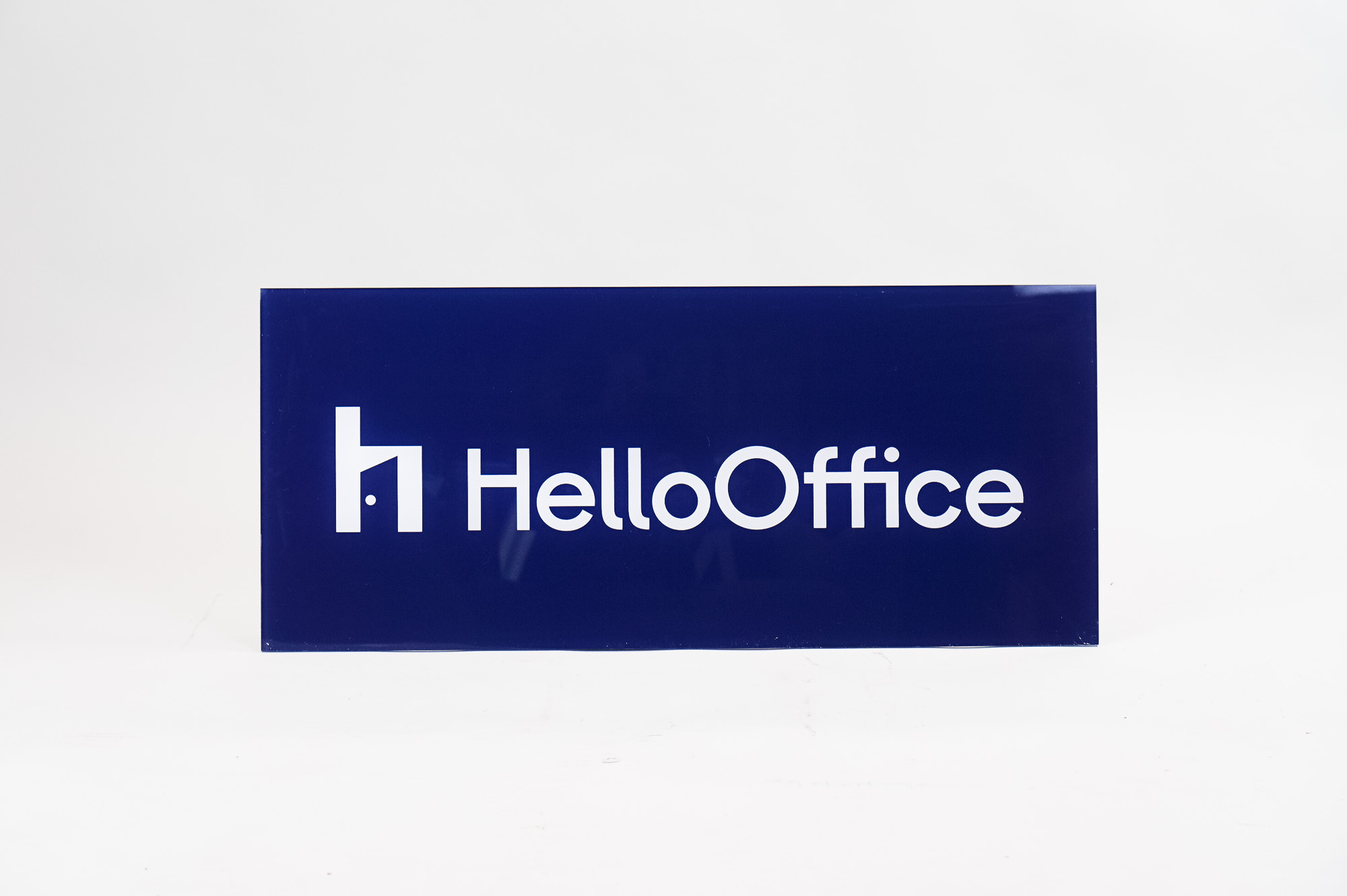 Glossy navy blue sign with white artwork for HelloOffice, a San Francisco based commercial brokerage built by startup founders, for startup founders.