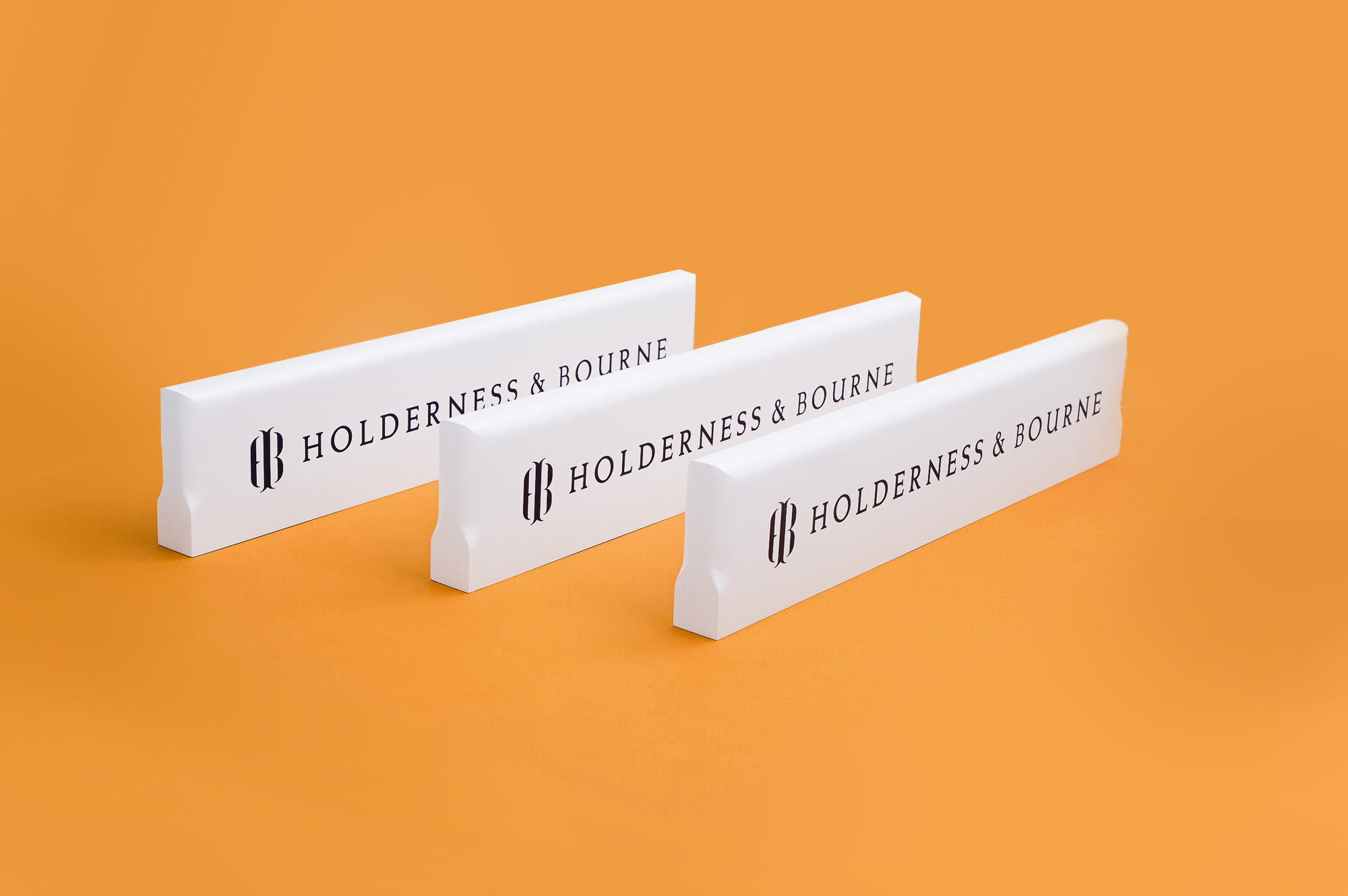 White and navy blue wood retail signs for Holderness & Bourne, a premium golf apparel and accessories company. White and navy blue wood retail signs for Holderness & Bourne, a premium golf apparel and accessories company.
