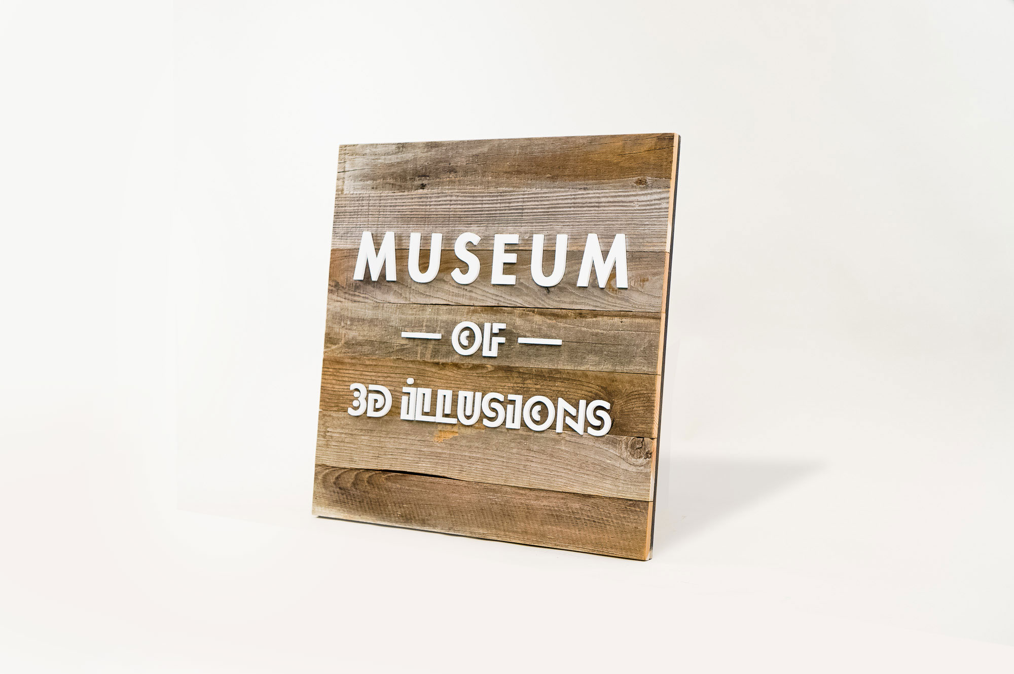 Reclaimed wood blade sign with white artwork for Museum of 3D Illusions in San Francisco. Reclaimed wood blade sign with white artwork for Museum of 3D Illusions in San Francisco.